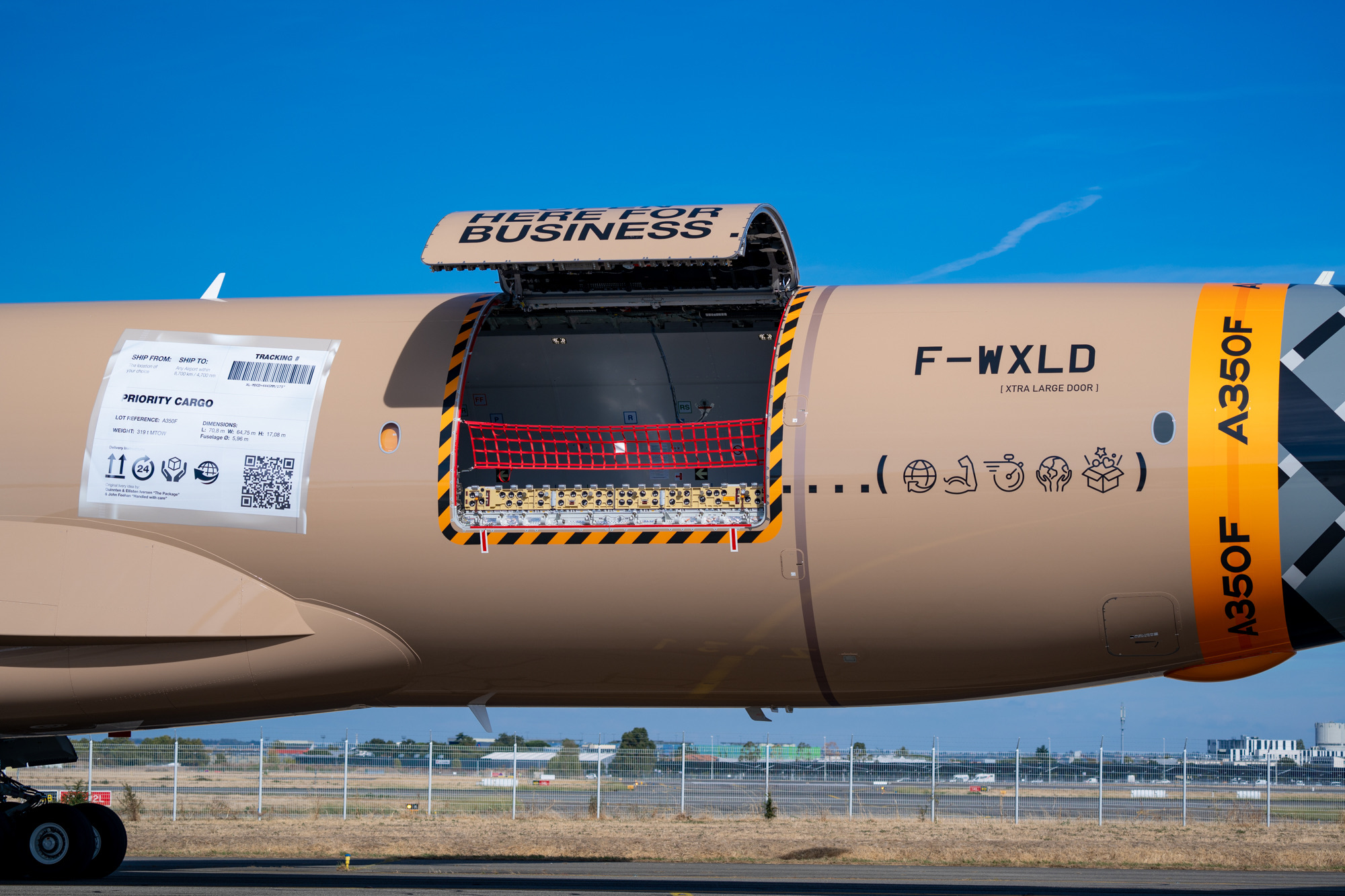 Open main-deck cargo door beside the F-WXLD registration.