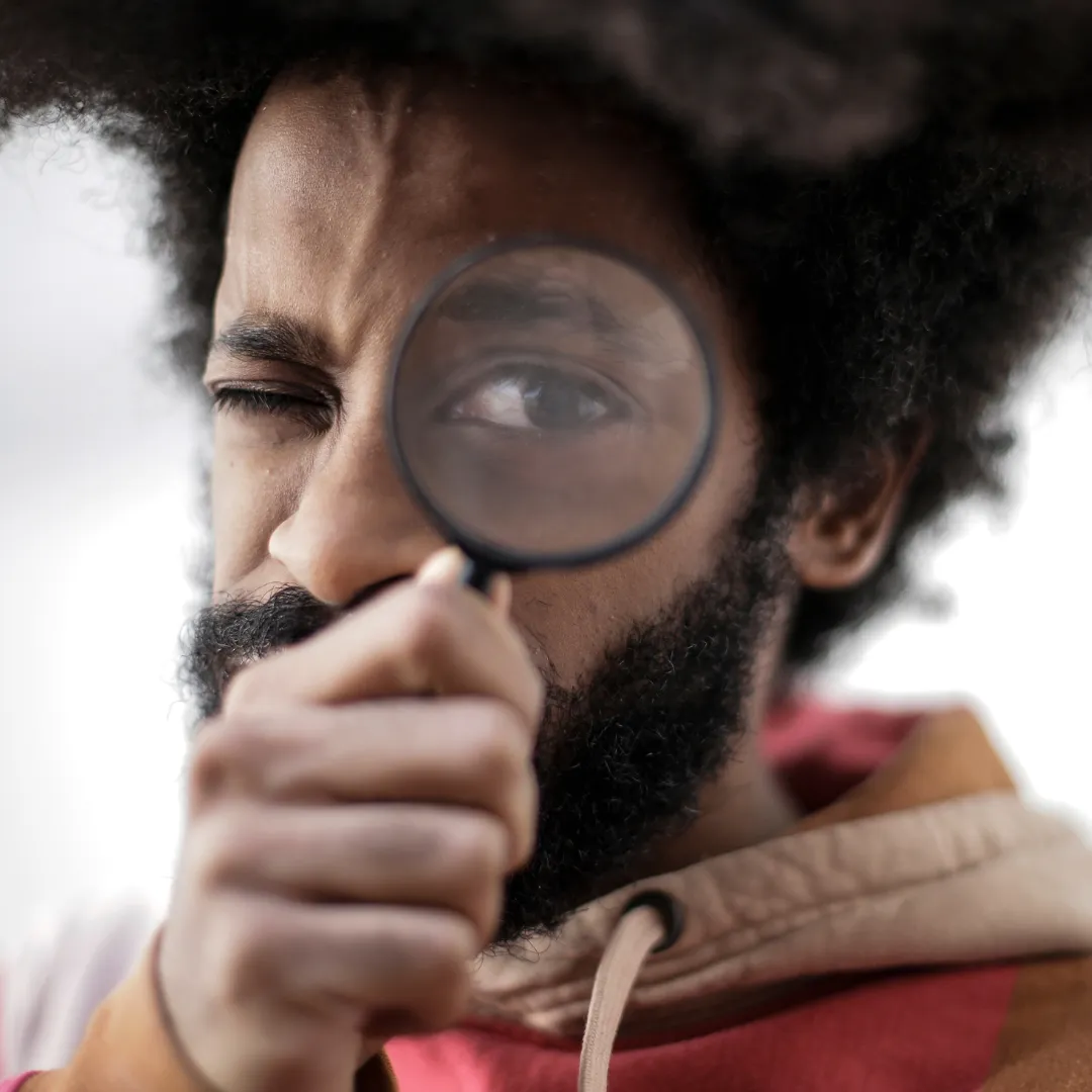 Man holding magnifying glass