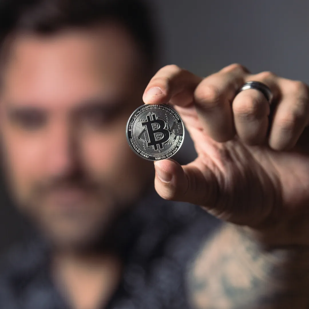 Man holding a bitcoin prop