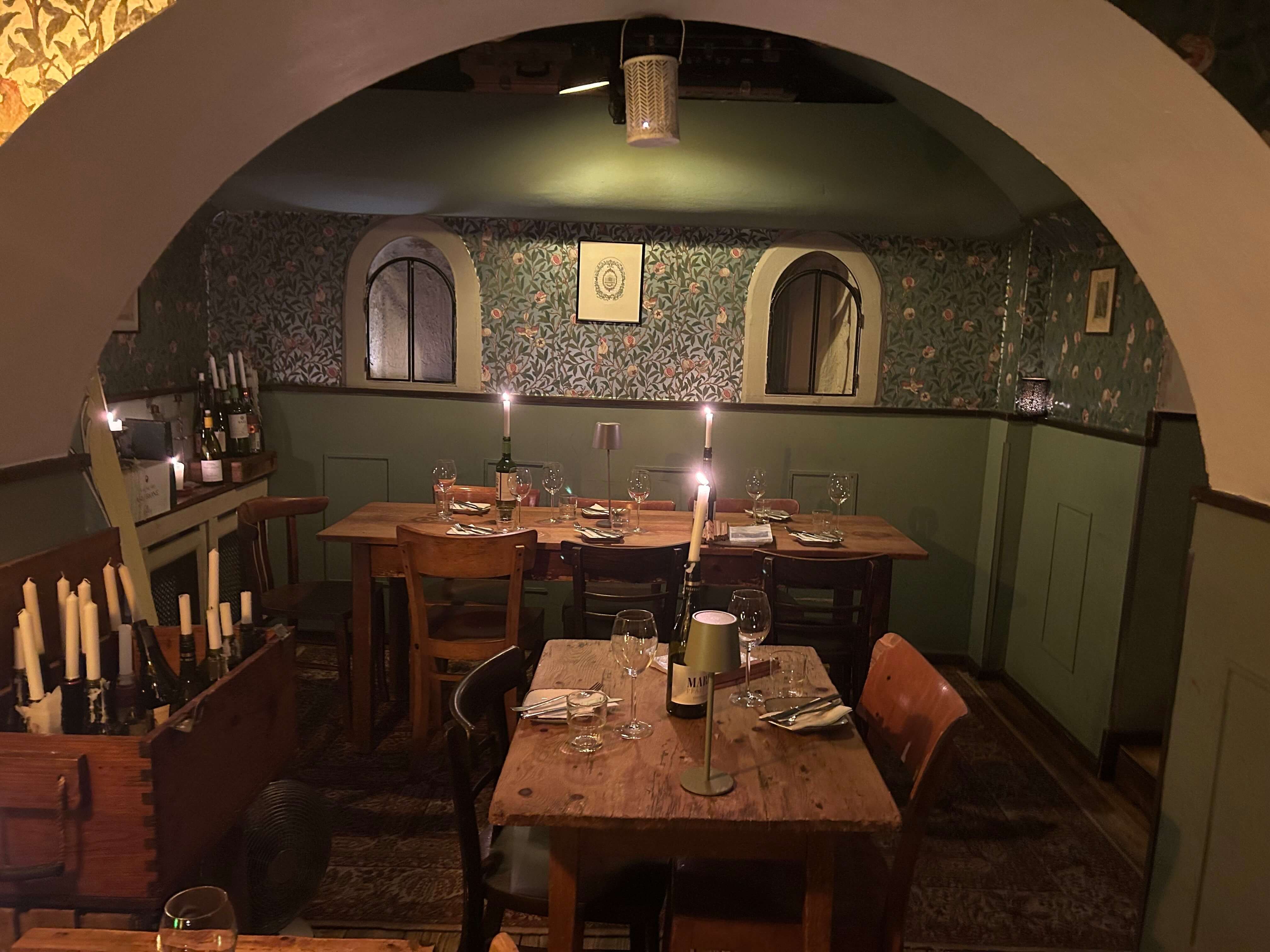 restaurant celllar with dining tables and candles