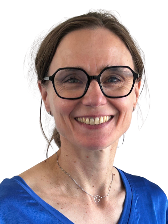 women with a blue blouse and big glasses smiling
