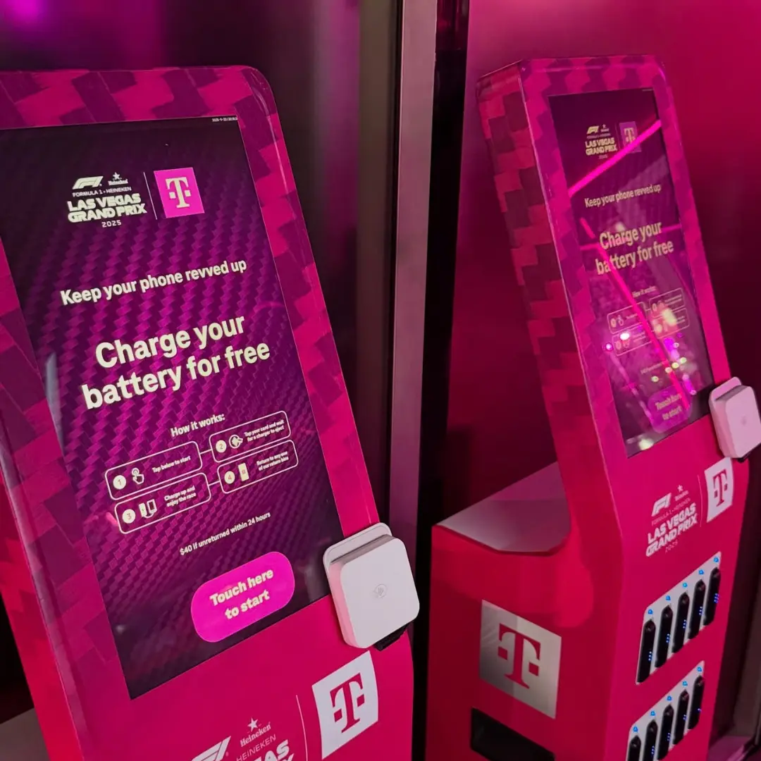 Multi-device charging hub kiosks branded by T-Mobile at the 2025 Formula 1 Las Vegas Grand Prix offering free portable charger rentals