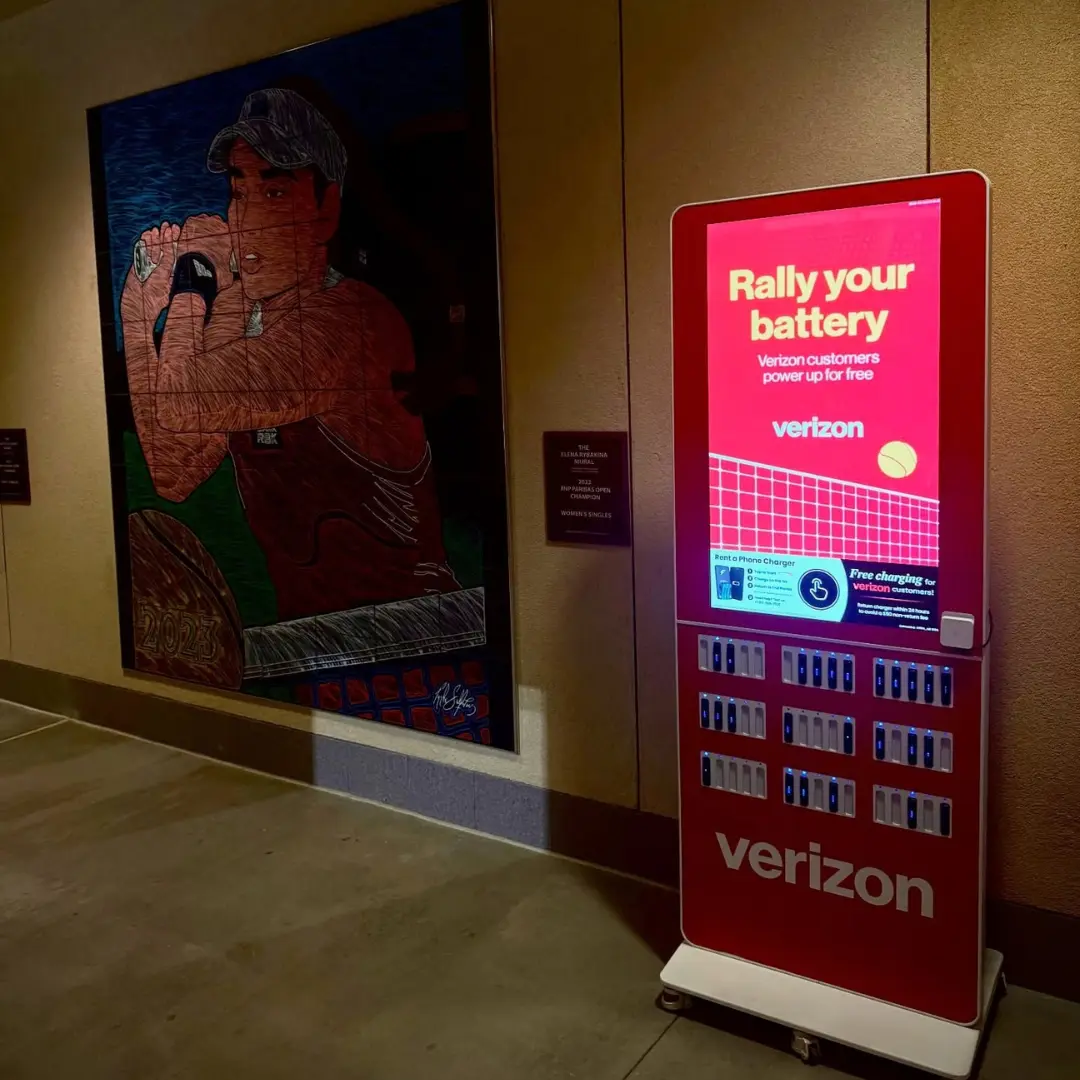 Phone charging stations for events displayed as a red ChargeFUZE kiosk at Resorts World offering portable charger rentals