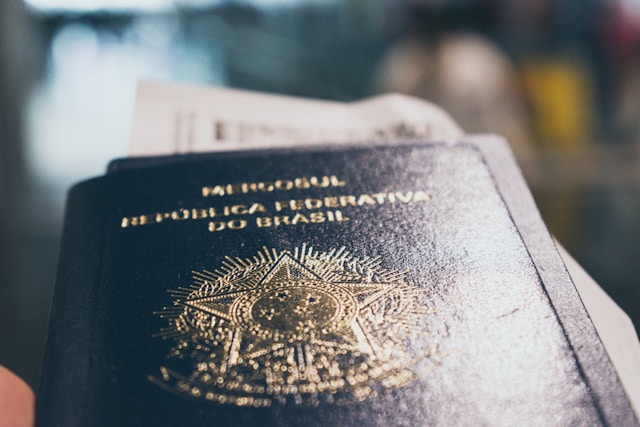 A Brazilian passport with airline tickets