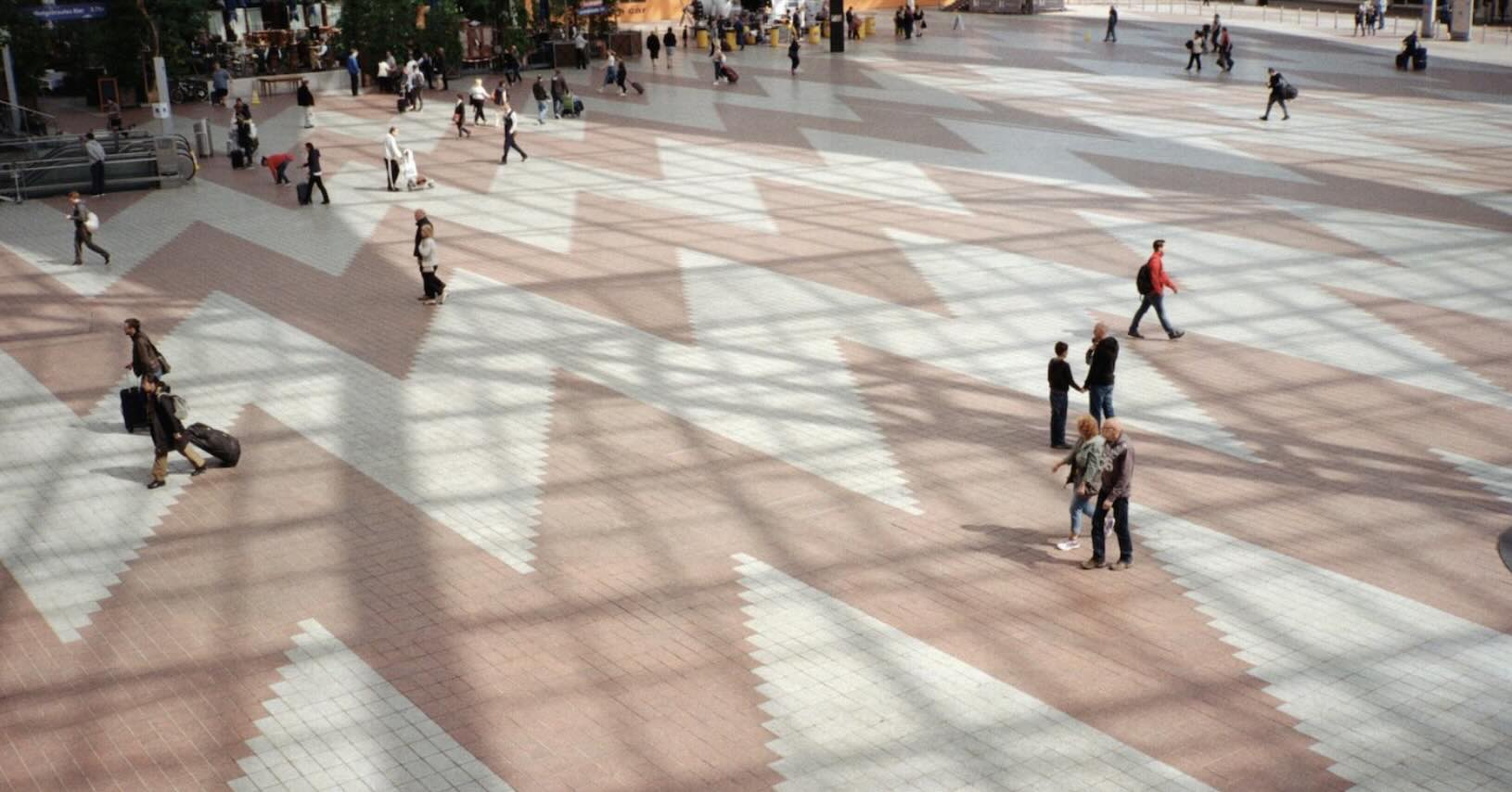 People walking through an airport