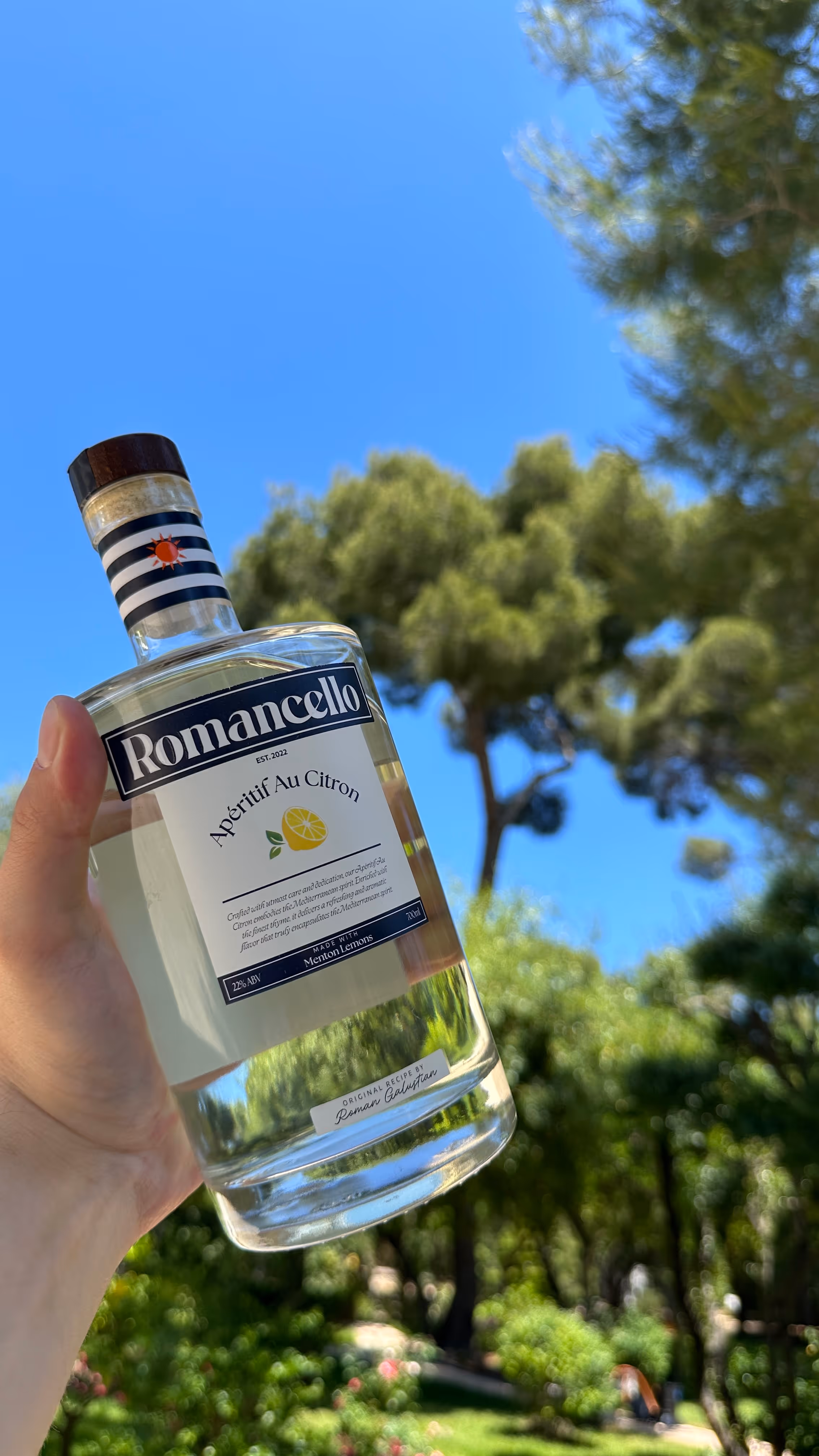 Romancello premium lemon aperitif bottle against the French Riviera backdrop
