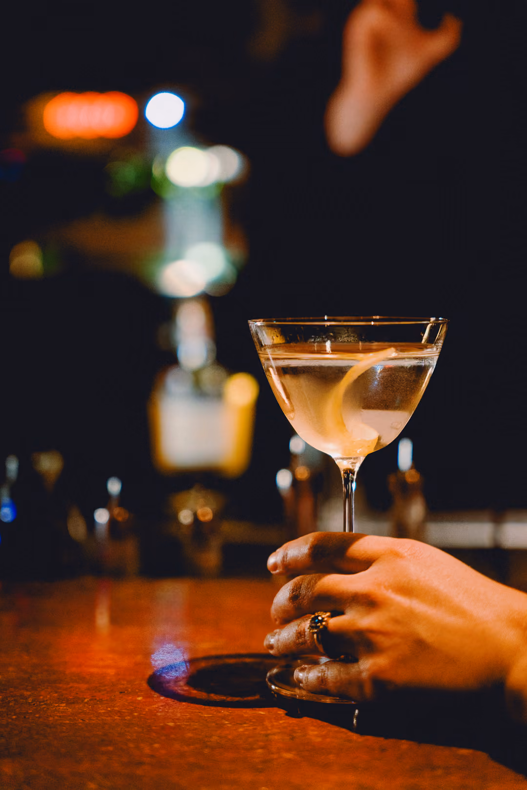 Romancello Martini in a chilled martini glass with a lemon peel