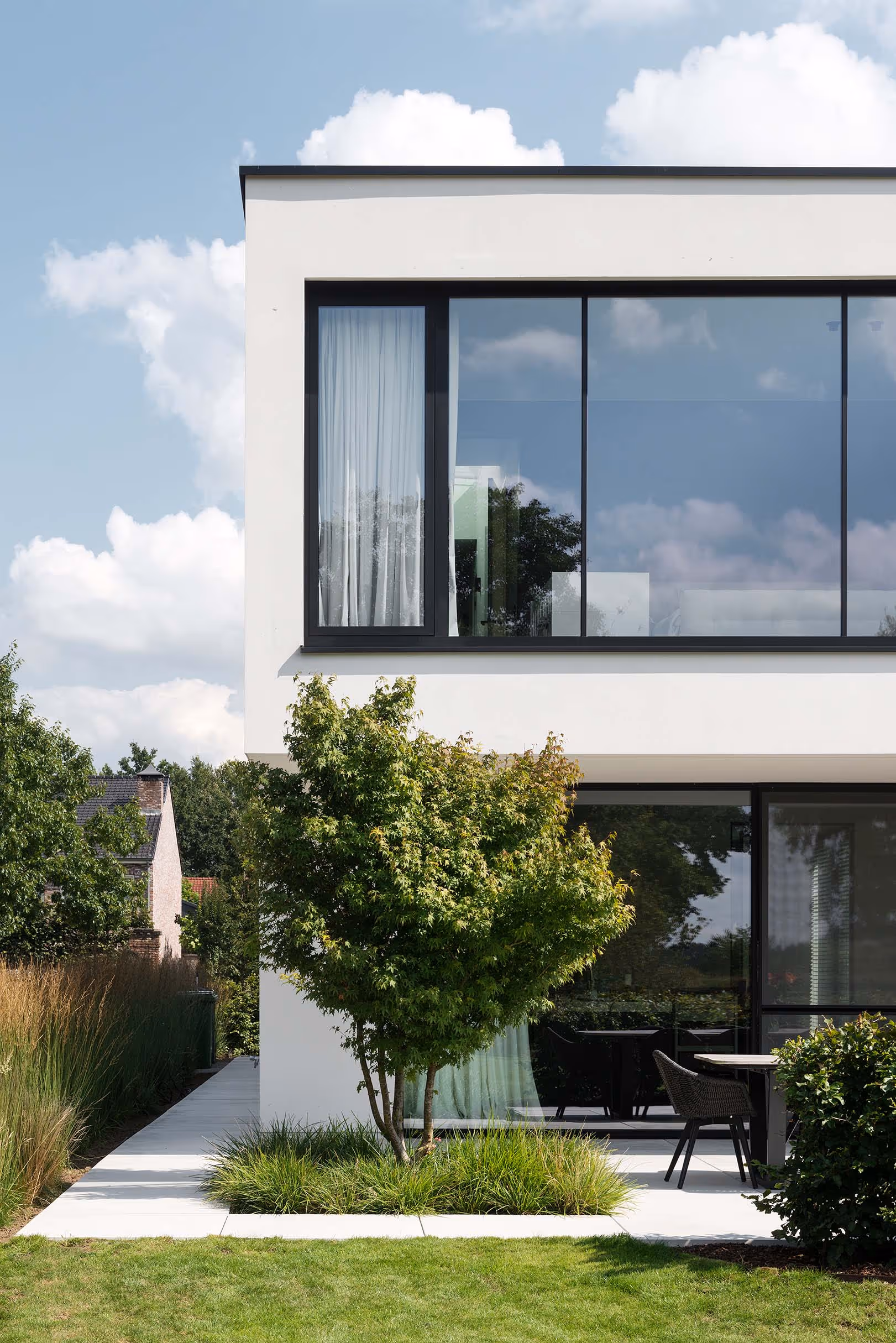 Stylish house with glass upper level over looking a garden