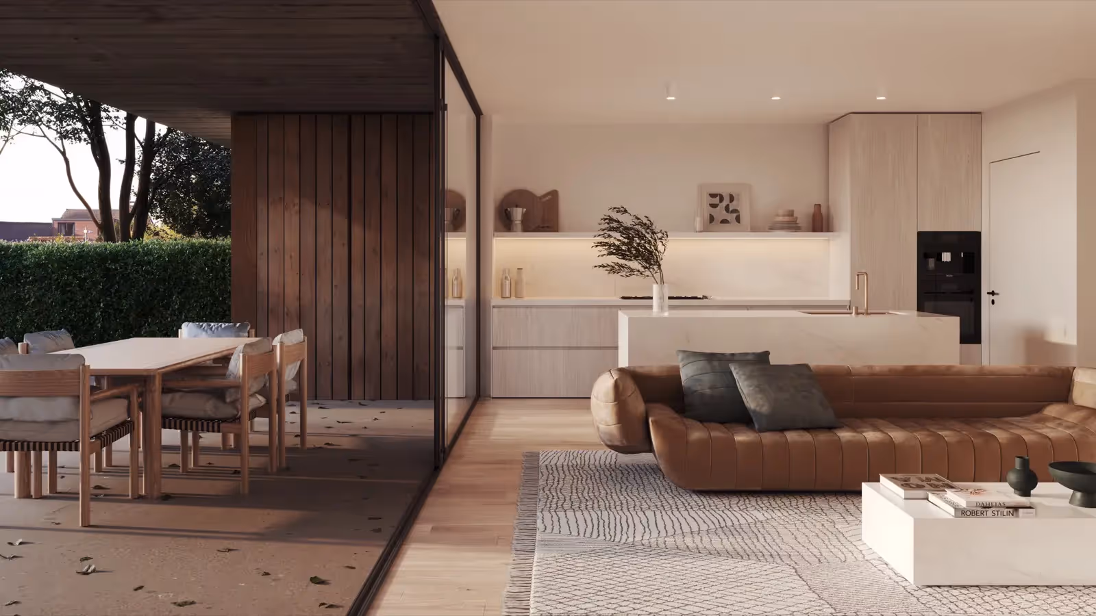 Stijlvol interieur van een moderne woonkamer met open keuken en zicht op de tuin.