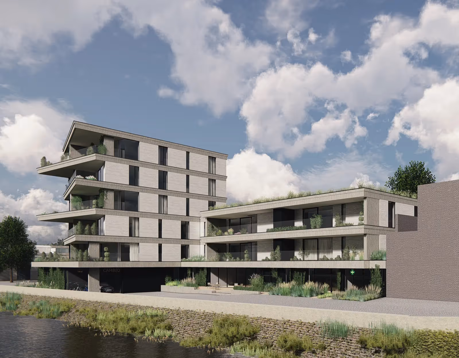 Modern appartementsgebouw met groendaken aan waterkant