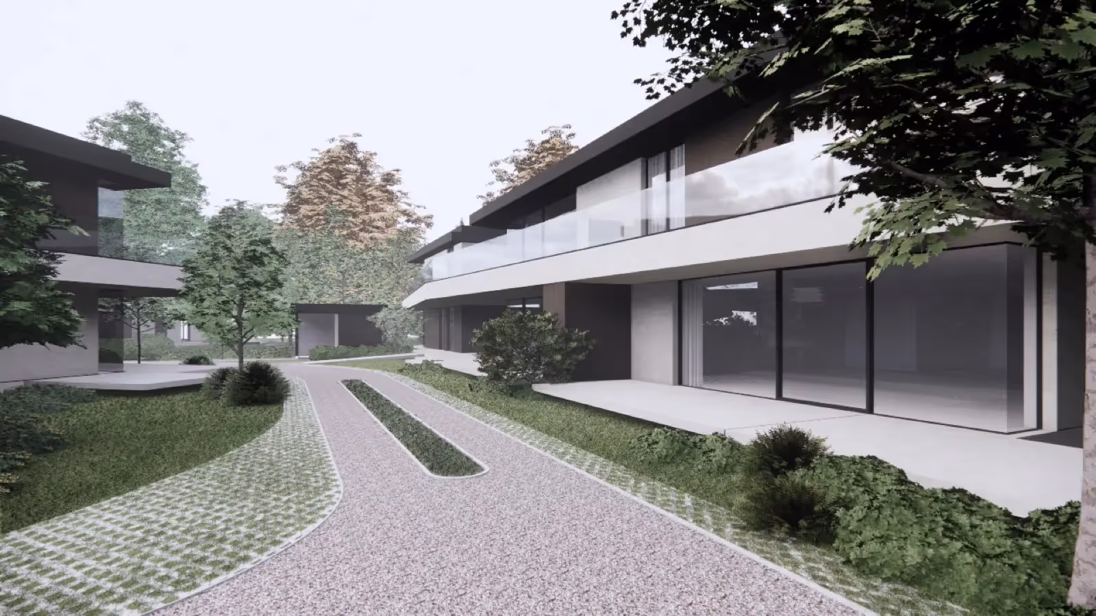 Strakke moderne woningen met platte daken en grote glaspartijen omgeven door aangelegde tuinen.