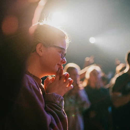 People on a conference listening and smiling