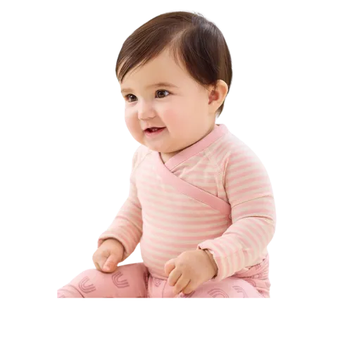 Happy baby girl wearing pink striped shirt smiling at camera