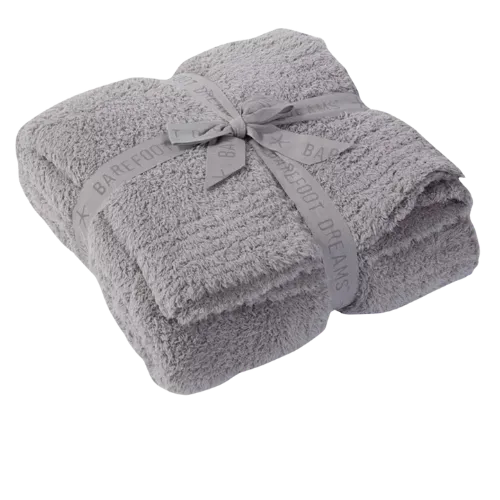 Stack of folded gray fluffy towels tied with a gray ribbon bow