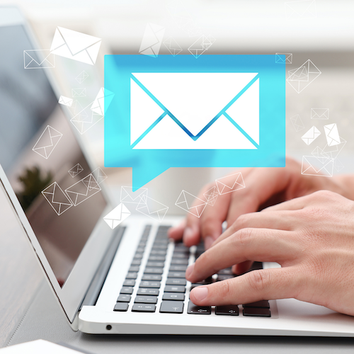 Enlarged email icon displayed on a laptop screen.