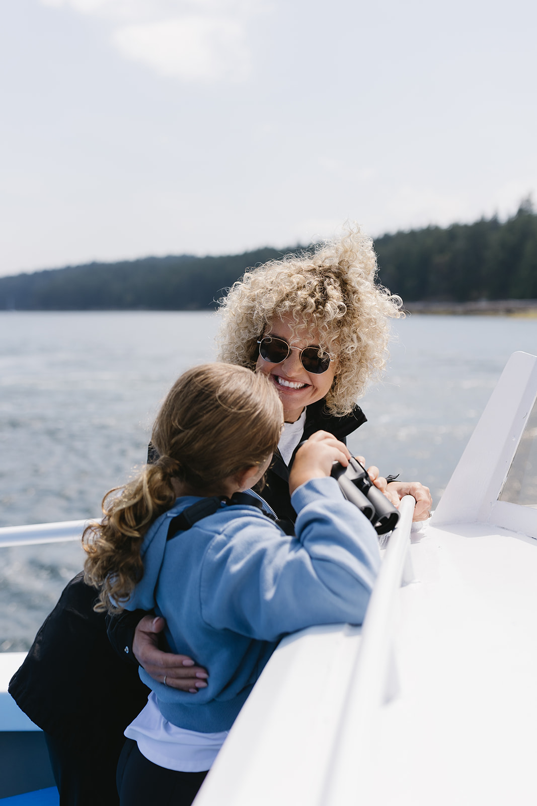 Mom and daughter on a whale watching boat