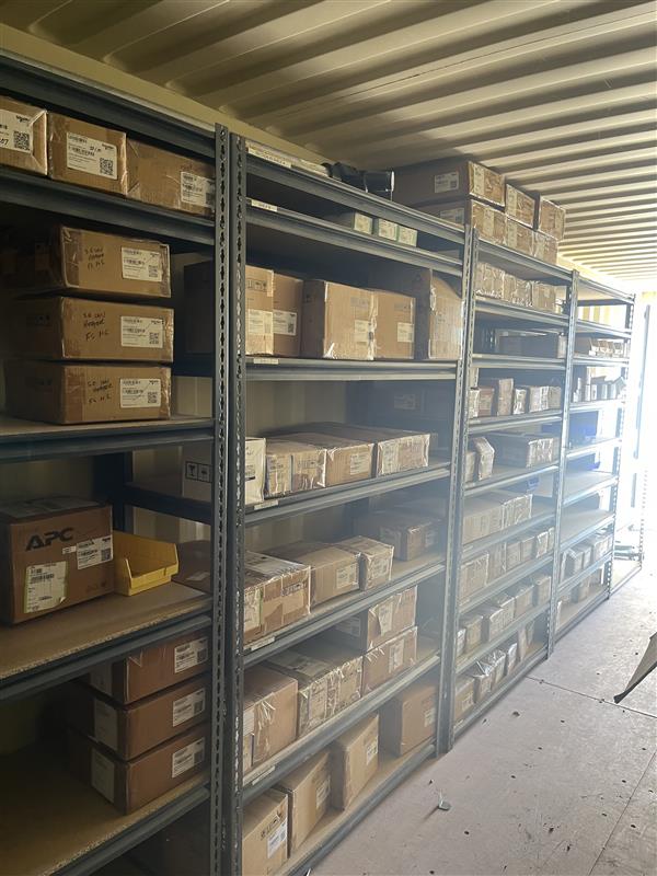 Enfinity spare parts storage in February 2026: labelled parts on organised shelving