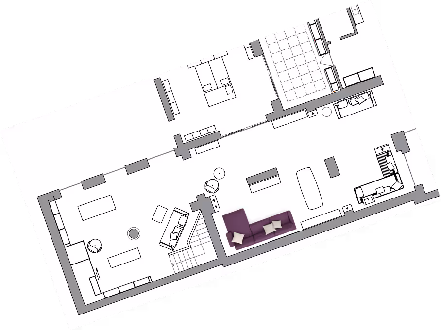 Architectural floor plan showing a layout with multiple rooms and furniture, including a purple sofa with white pillows in one room.