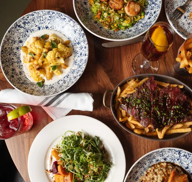 Table showing delicious entrees at Bandol restaurant, Chicago, IL