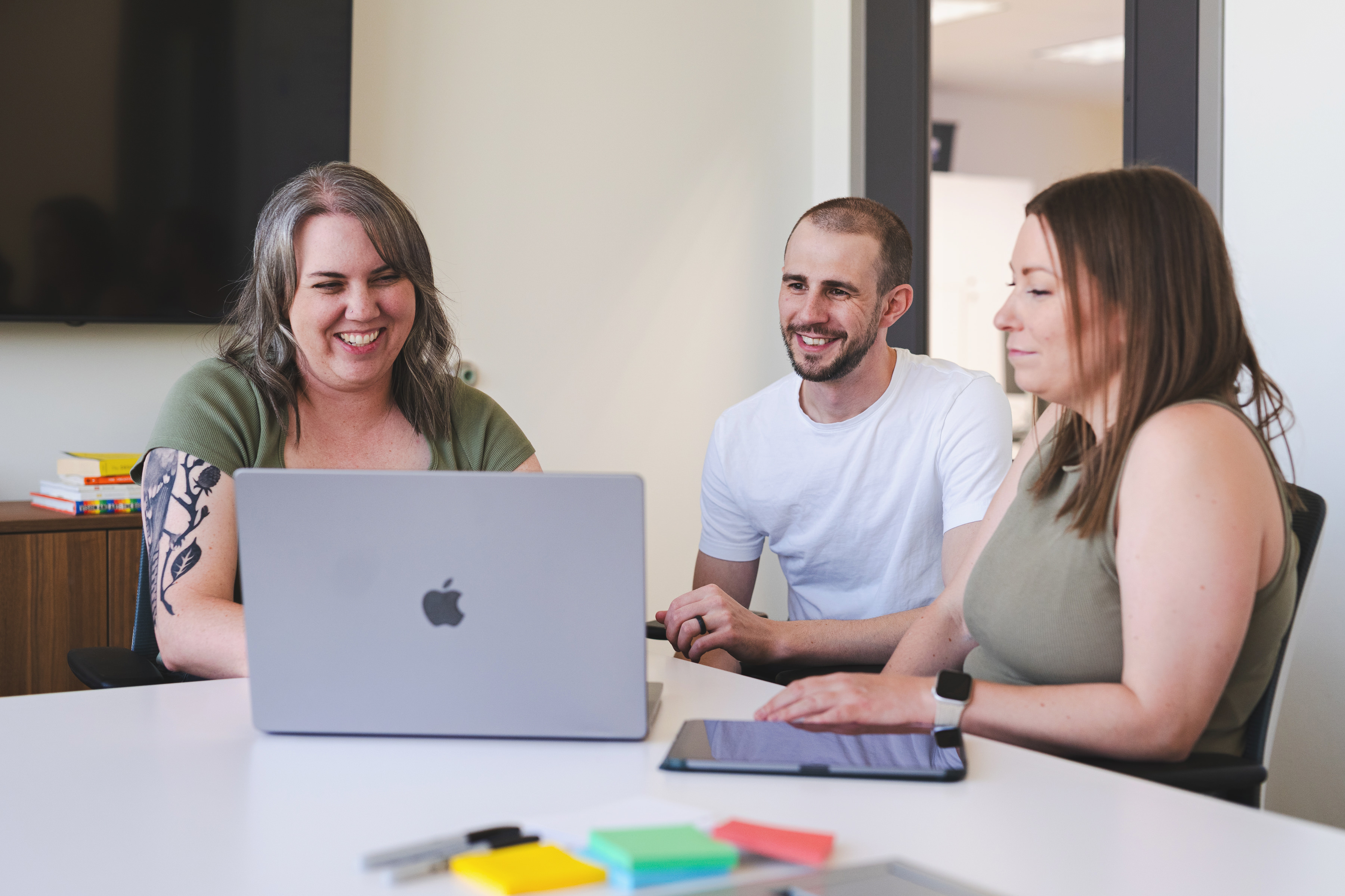 Tech9 design team in a collaborative brainstorming session