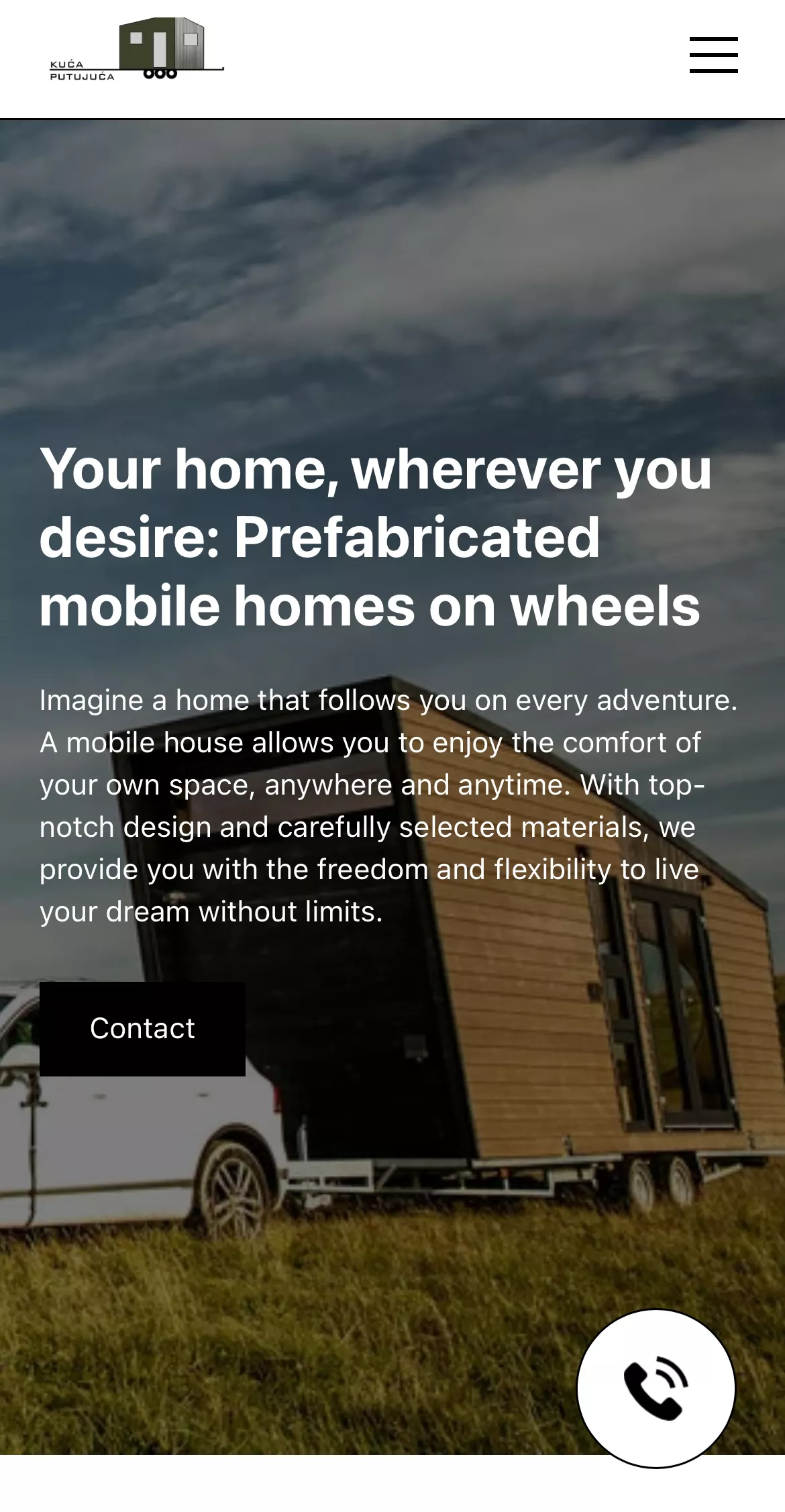 White pickup truck towing a modern wooden mobile home on wheels parked on grassy field under a partly cloudy sky.