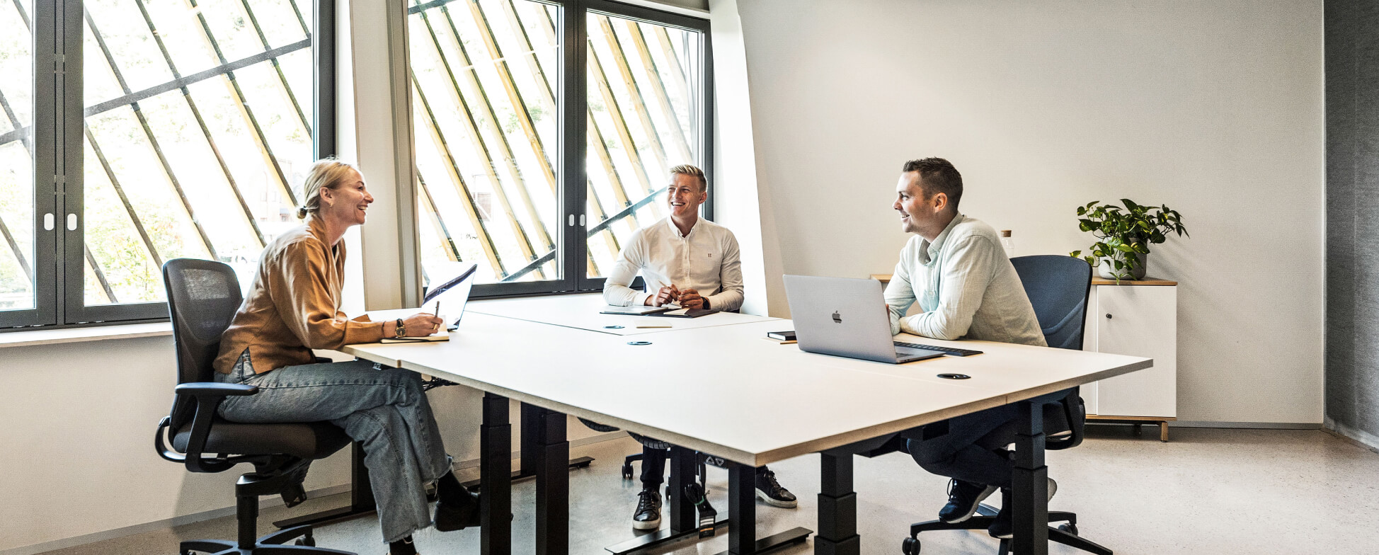 3 people in Evolve meeting room