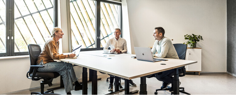 3 people in Evolve meeting room