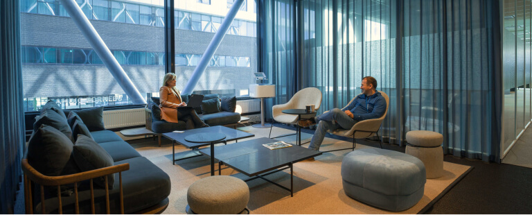 Two people talking in a common area
