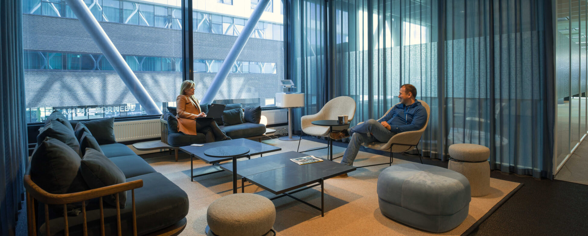 Two people talking in a common area 