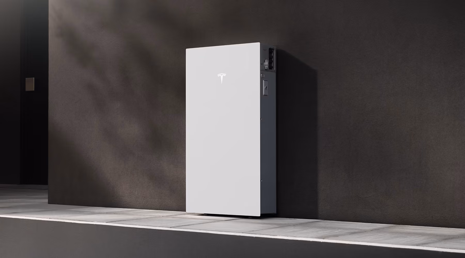Tesla Powerwall 3 gemonteerd tegen een donkere wand in een moderne woning