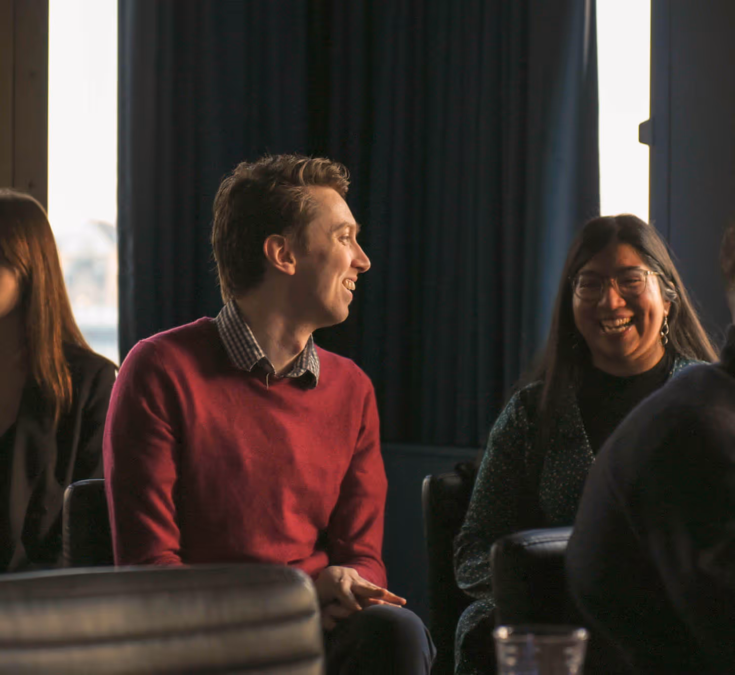 Ryan Peggs and Aleena Baig laughing together at social.