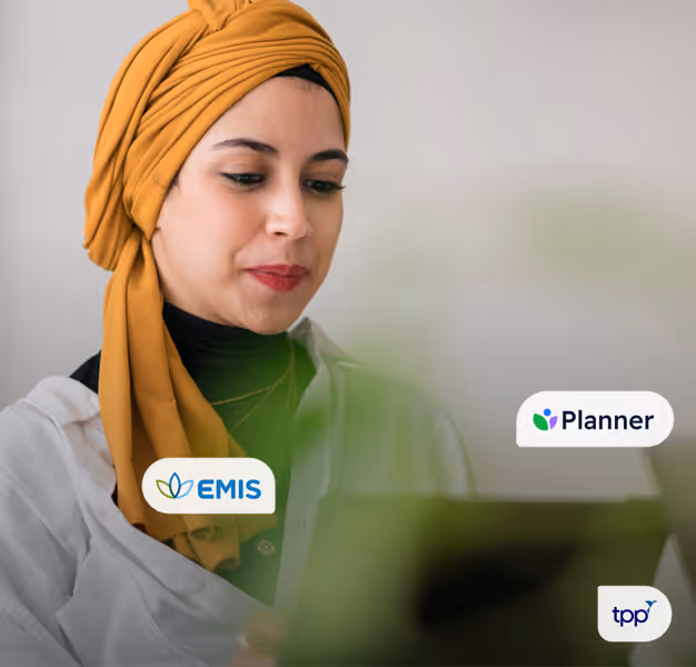 A pharmacist using their laptop to access EHR systems.