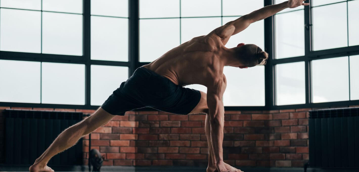 Man holding a yoga pose