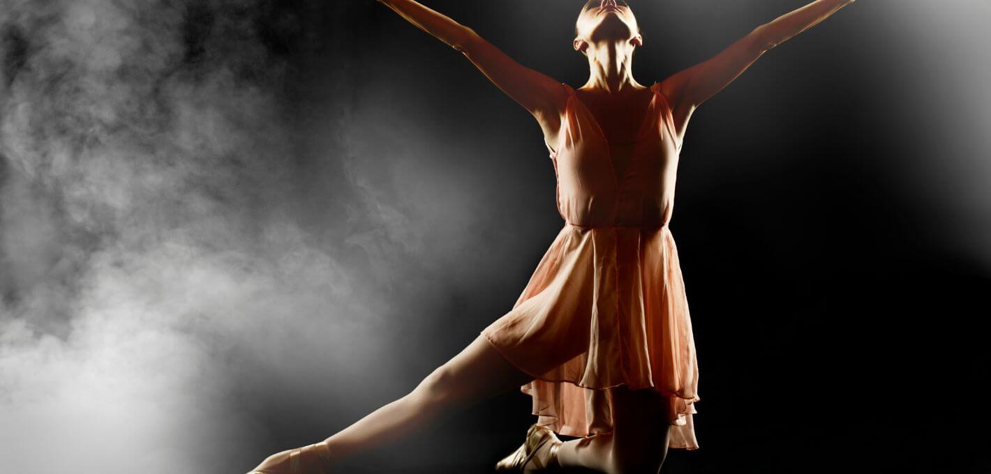 Dancer on her knees looking up