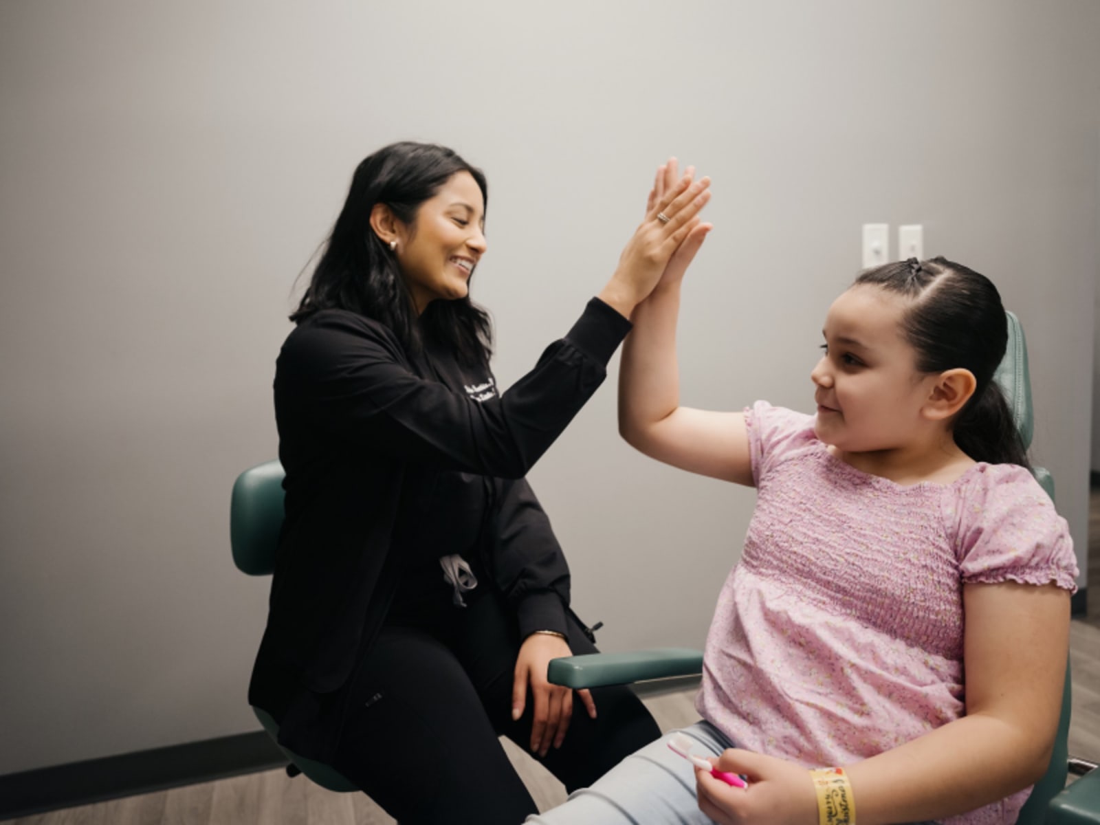 Dentist discussing tooth restoration options with a young patient