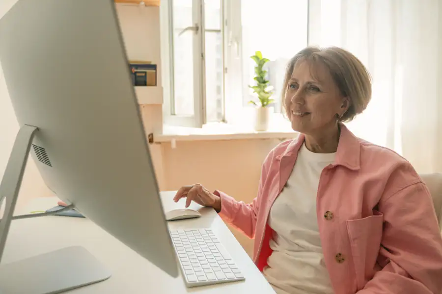 Woman smiling during a virtual visit at her computer