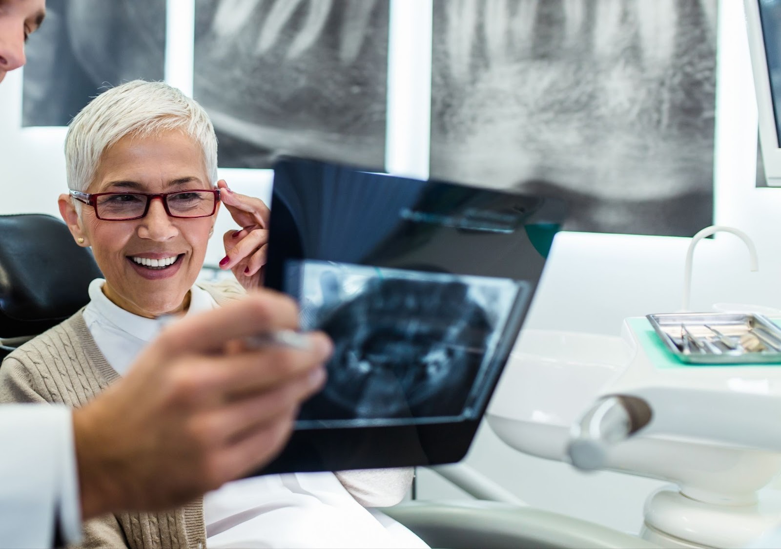 Patient discussing dental implant x-rays with implant dentist at Feel Good Dental Croydon