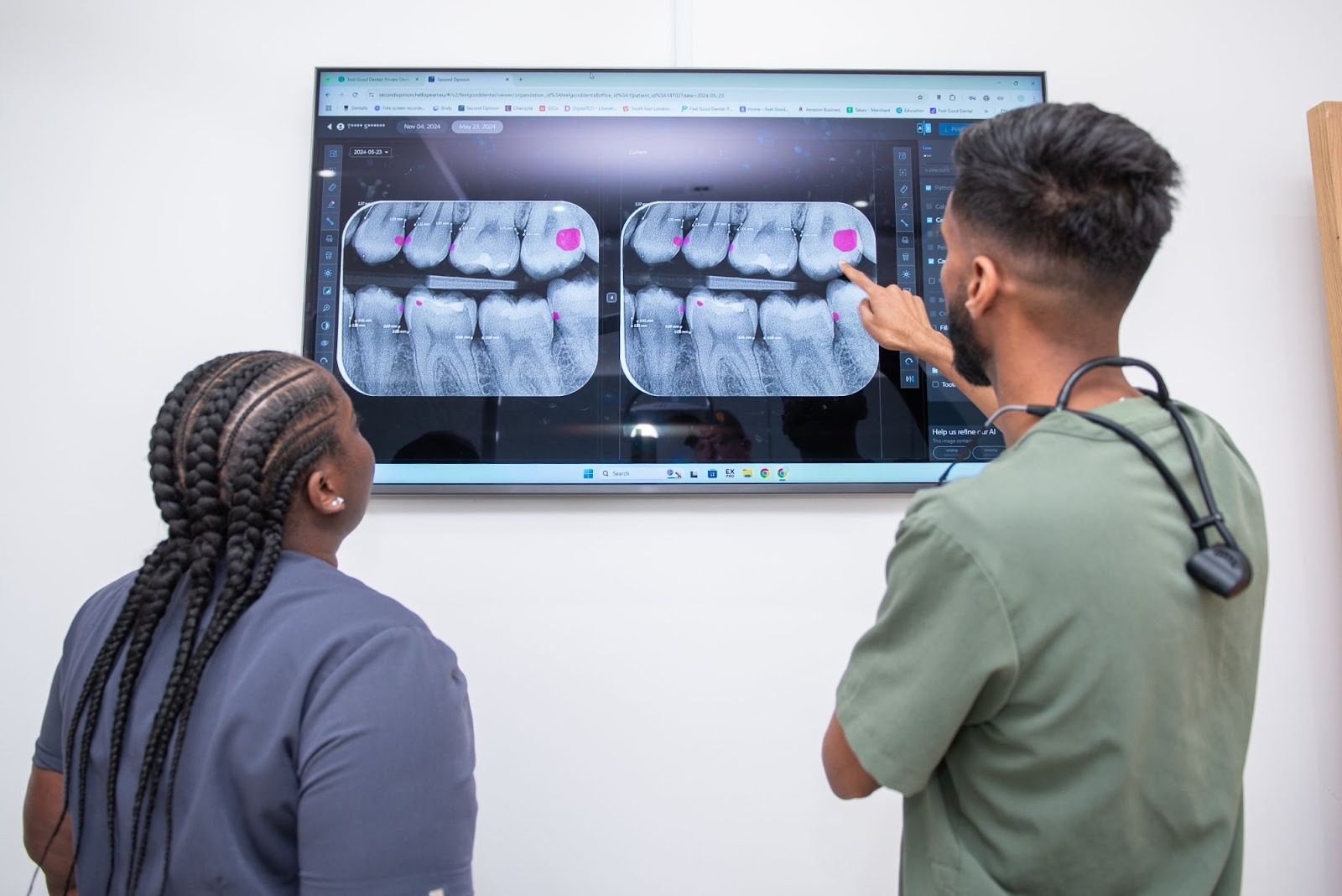 Dental team reviewing digital x-rays as part of dental implant treatment planning in Croydon
