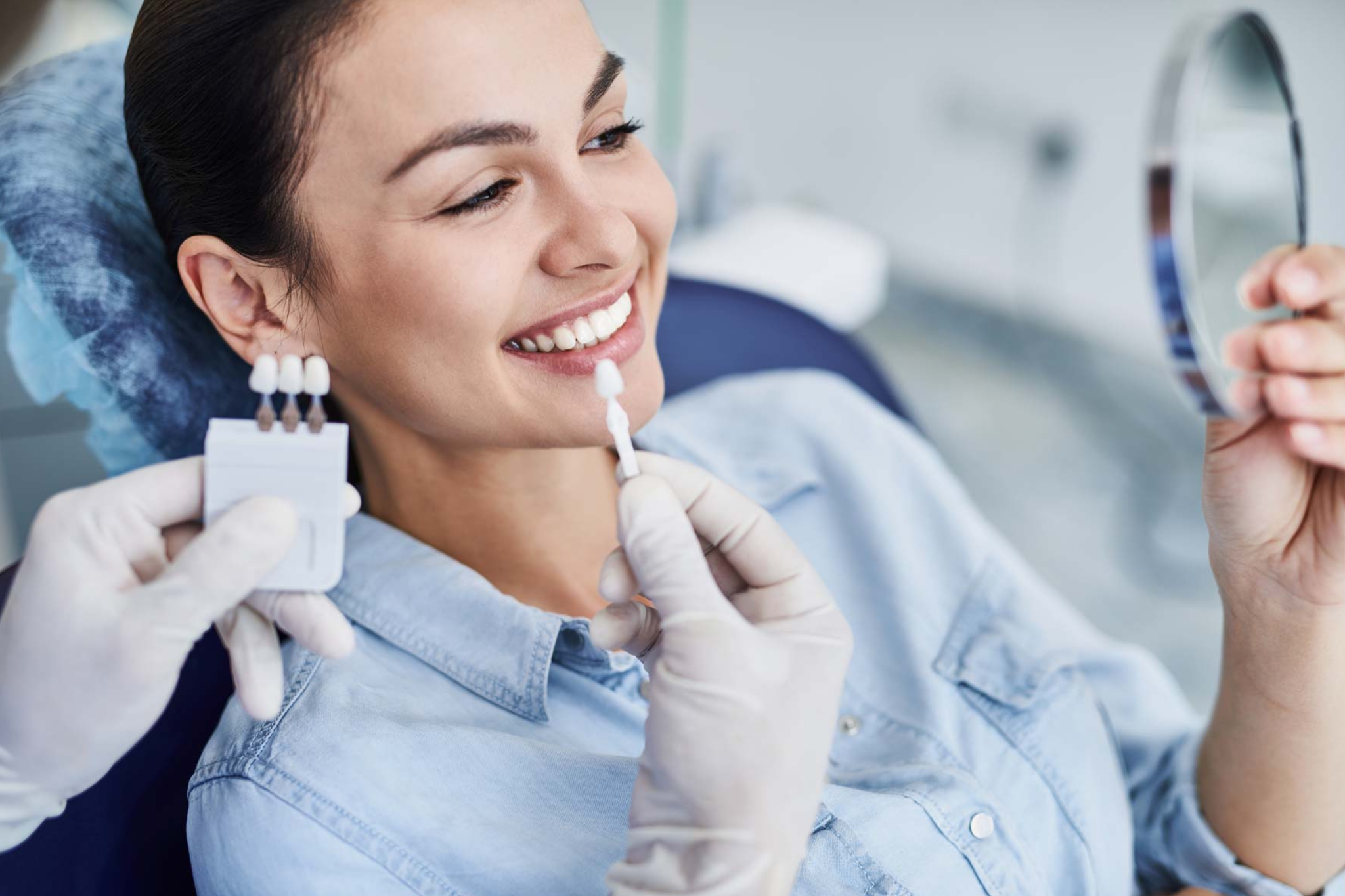 Patient discussing professional teeth whitening shade options during cosmetic dental consultation at Feel Good Dental Croydon
