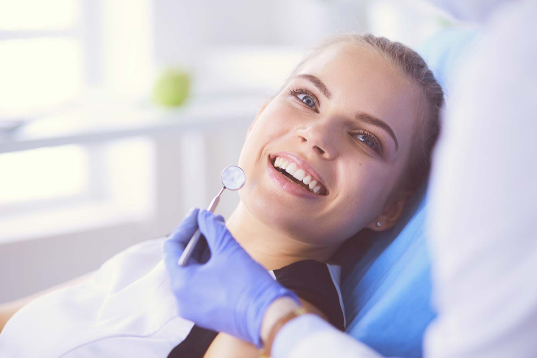 Patient discussing composite bonding treatment with cosmetic dentist in Croydon