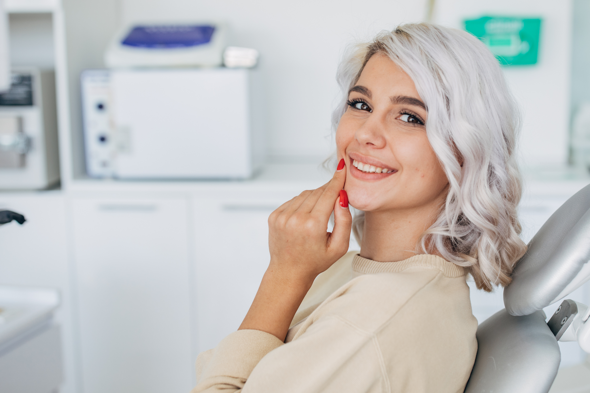 Patient smiling after cosmetic veneer consultation at Feel Good Dental Croydon