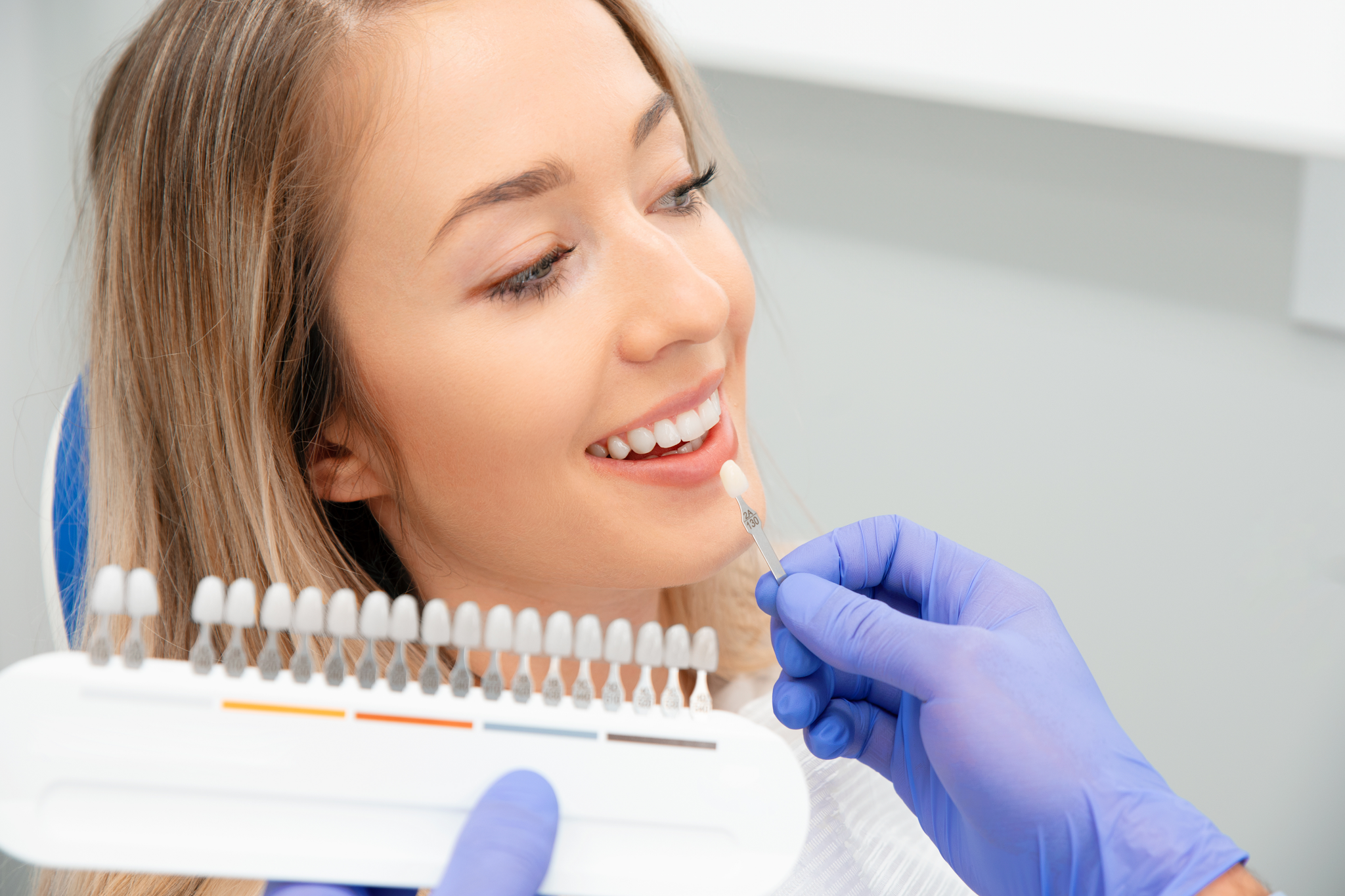 Patient selecting veneer shade during cosmetic dentistry consultation in Croydon