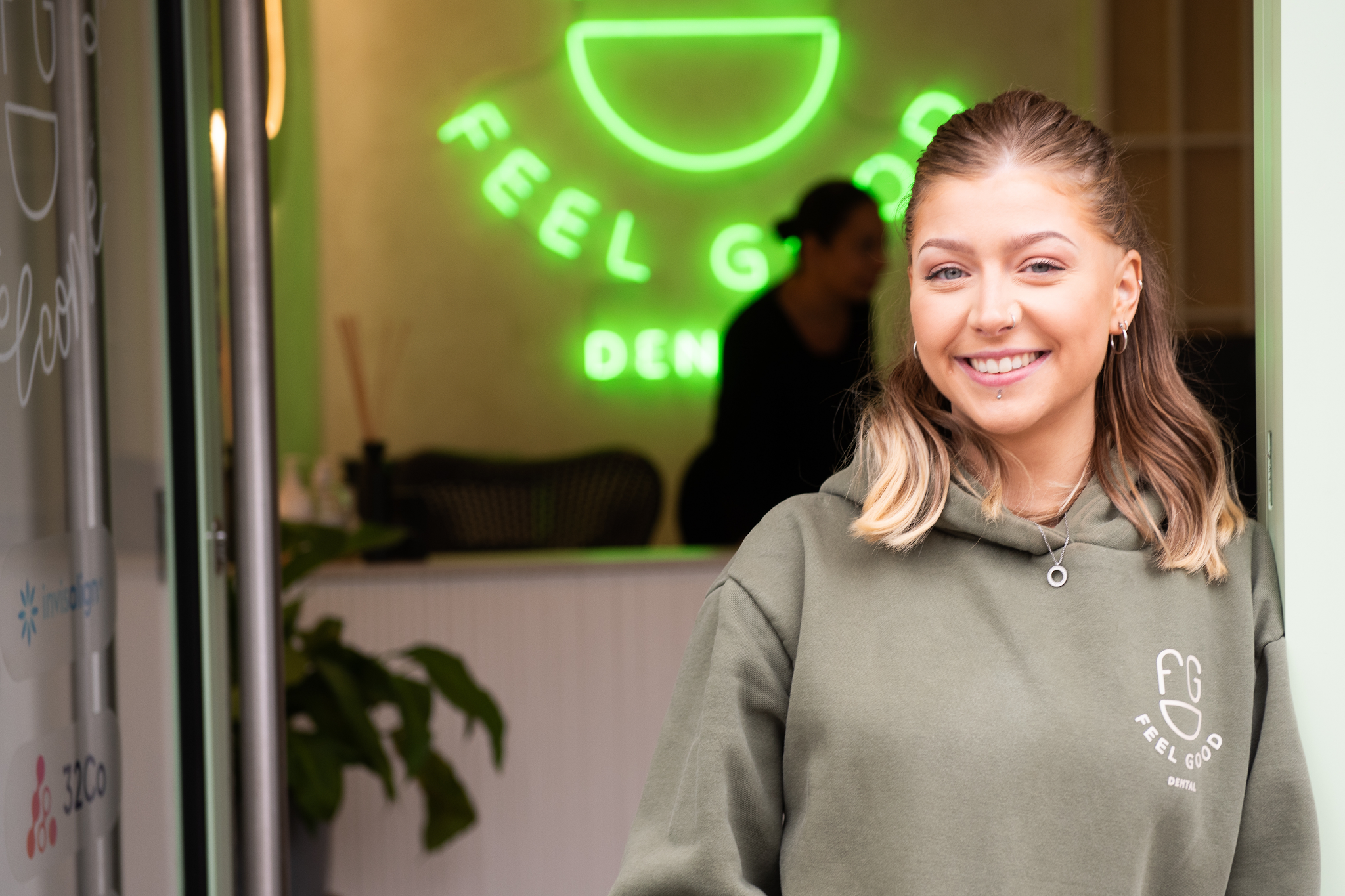 Treatment co-ordinator Eli welcoming veneers consultation patients at Feel Good Dental Croydon