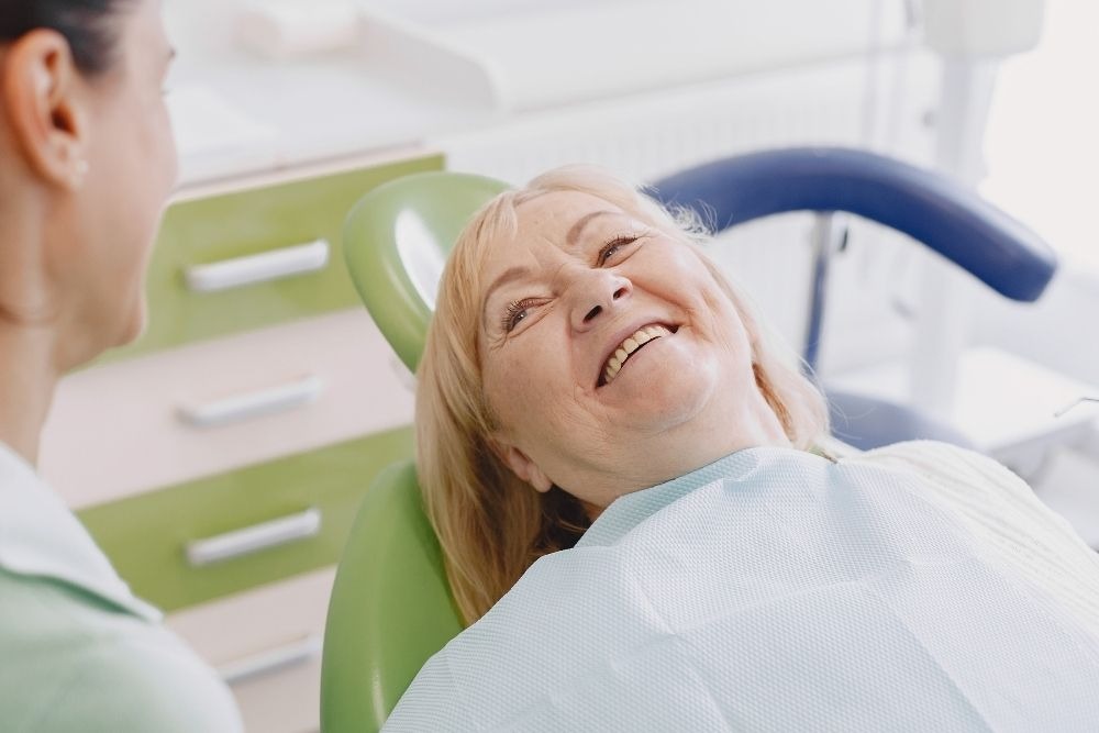 Patient smiling after dental implant treatment at Feel Good Dental in Croydon