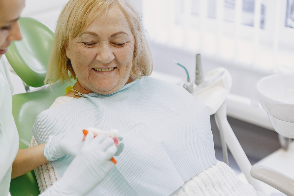 Patient discussing replacement teeth during a dental implant consultation