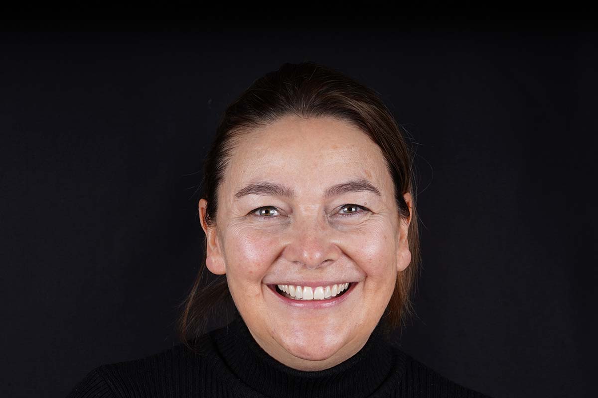 Smiling Foxley Lane Dental patient in Purley after composite bonding and professional teeth whitening, showing a bright and even smile.