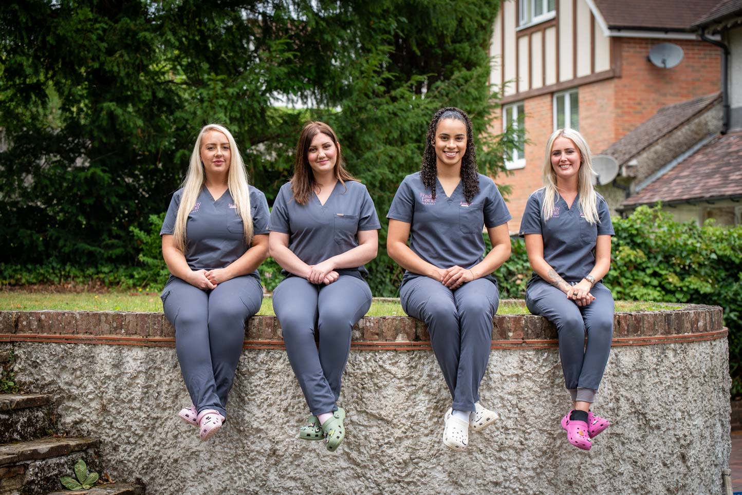 Friendly dental nurses from our Purley practice sitting outdoors.