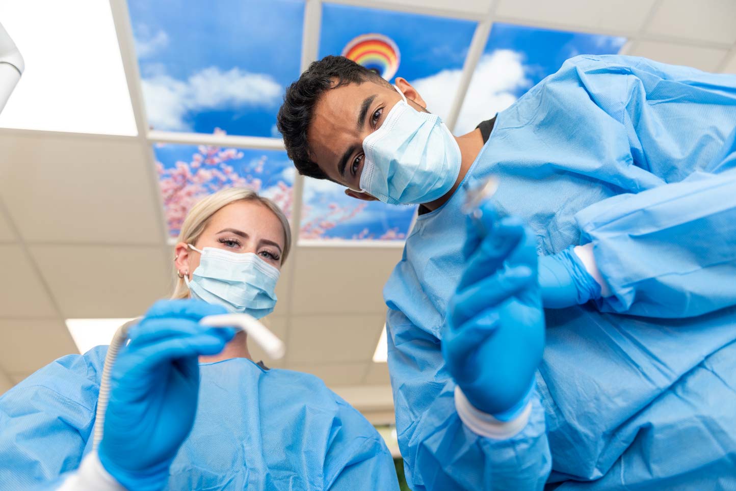 Dental hygienist at Foxley Lane Dental in Purley showing children’s toothbrushes and oral care products, helping families across Croydon, Wallington, Coulsdon and surrounding areas prevent tooth decay.