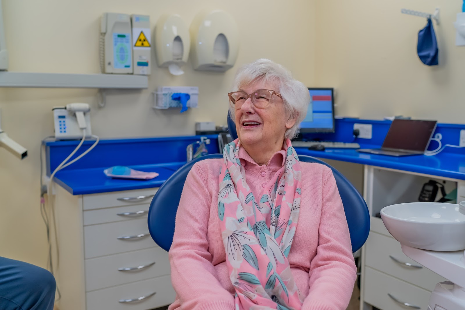 A smiling older lady prepares for a dental treatment at Foxley Lane Dental.