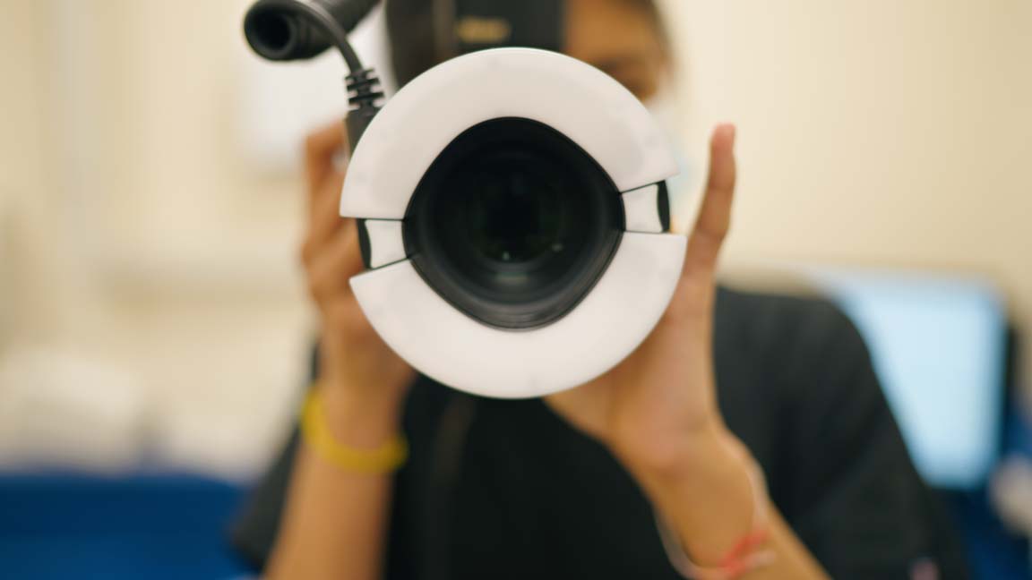 Dental professional taking before photos of teeth during a consultation at Foxley Lane Dental.